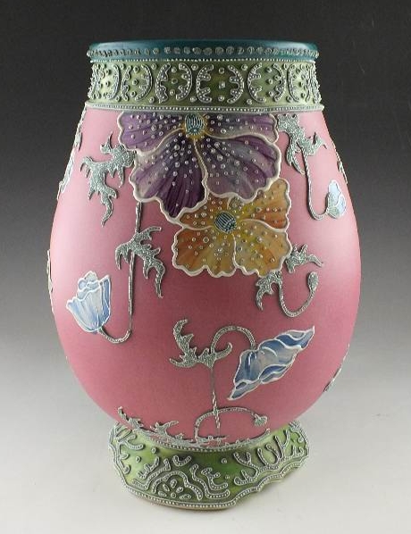 A hand painted and decorated Moriage Lamp in tinted hues of green red blue and grey