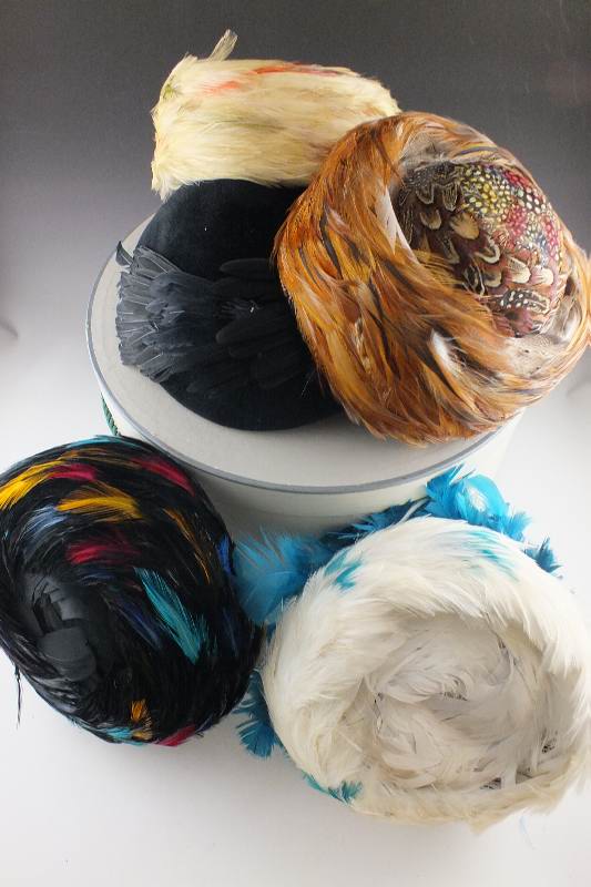 A collection of five vintage pill box style hats