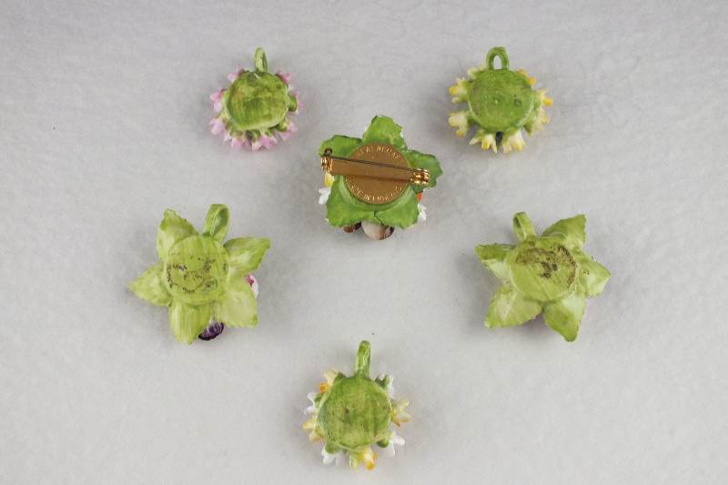 A made in England "Healacraft" floral porcelain pin