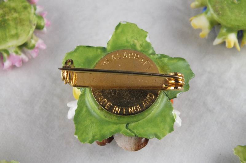 A made in England "Healacraft" floral porcelain pin