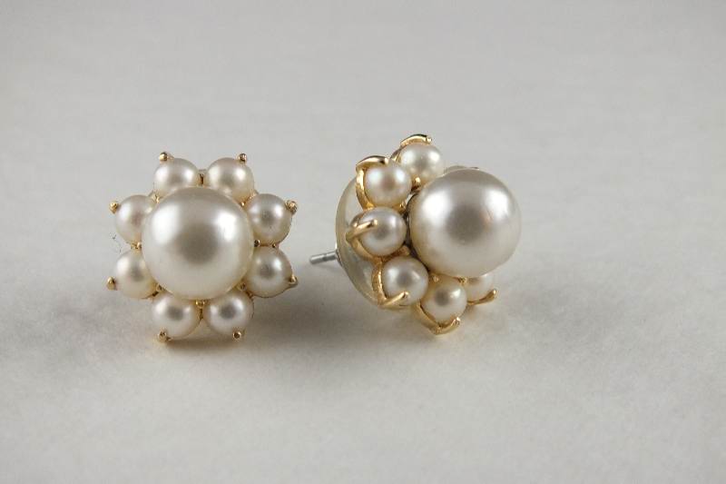 A pair of simulated pearl pierced earrings with removable jackets which are marked 585 14K