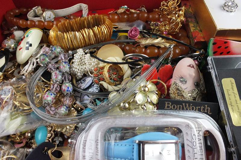 Assorted necklaces, pins, brooches, earrings, bracelets, and more