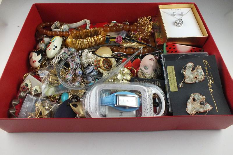 Assorted necklaces, pins, brooches, earrings, bracelets, and more