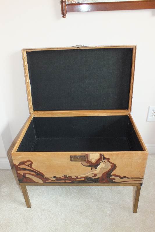 A painted leather like chest in the style of an Asian bride's trunk with two side handles