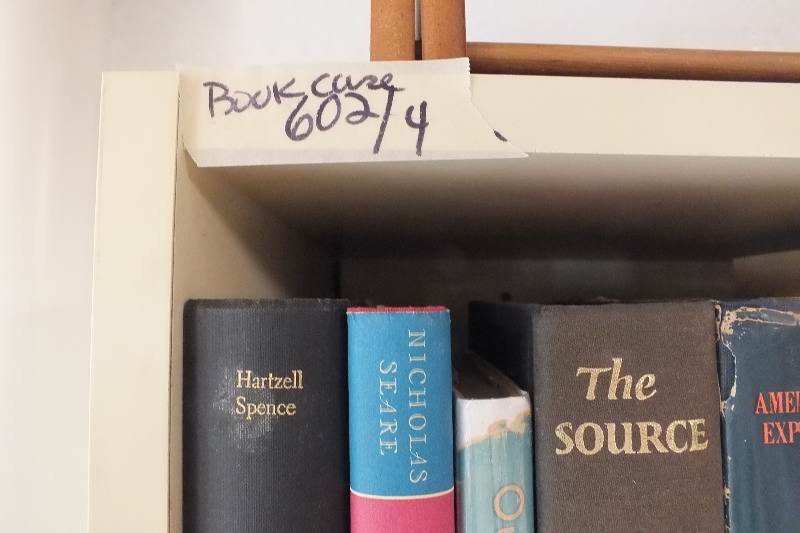 Four white laminate bookcases