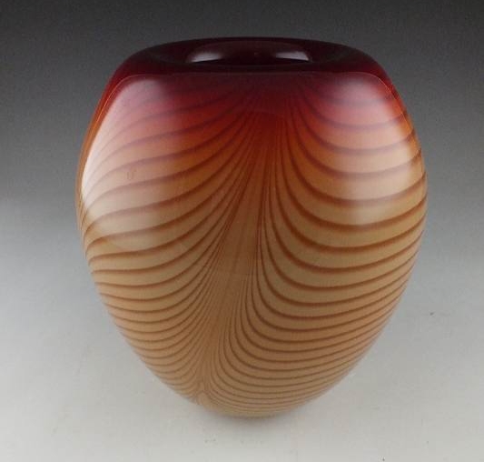 A hand blown art glass vase signed by artist, and dated