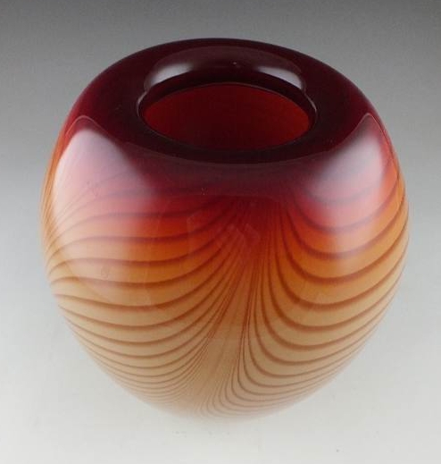 A hand blown art glass vase signed by artist, and dated