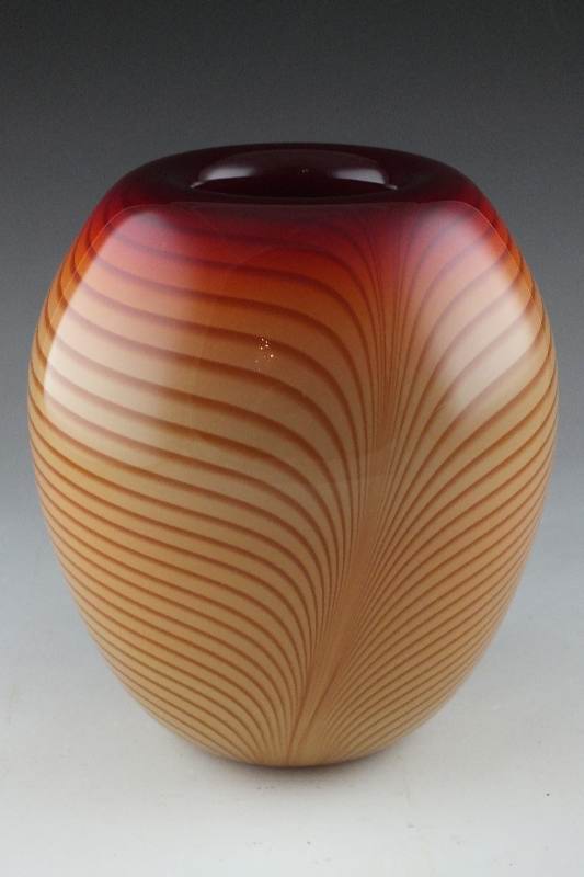 A hand blown art glass vase signed by artist, and dated