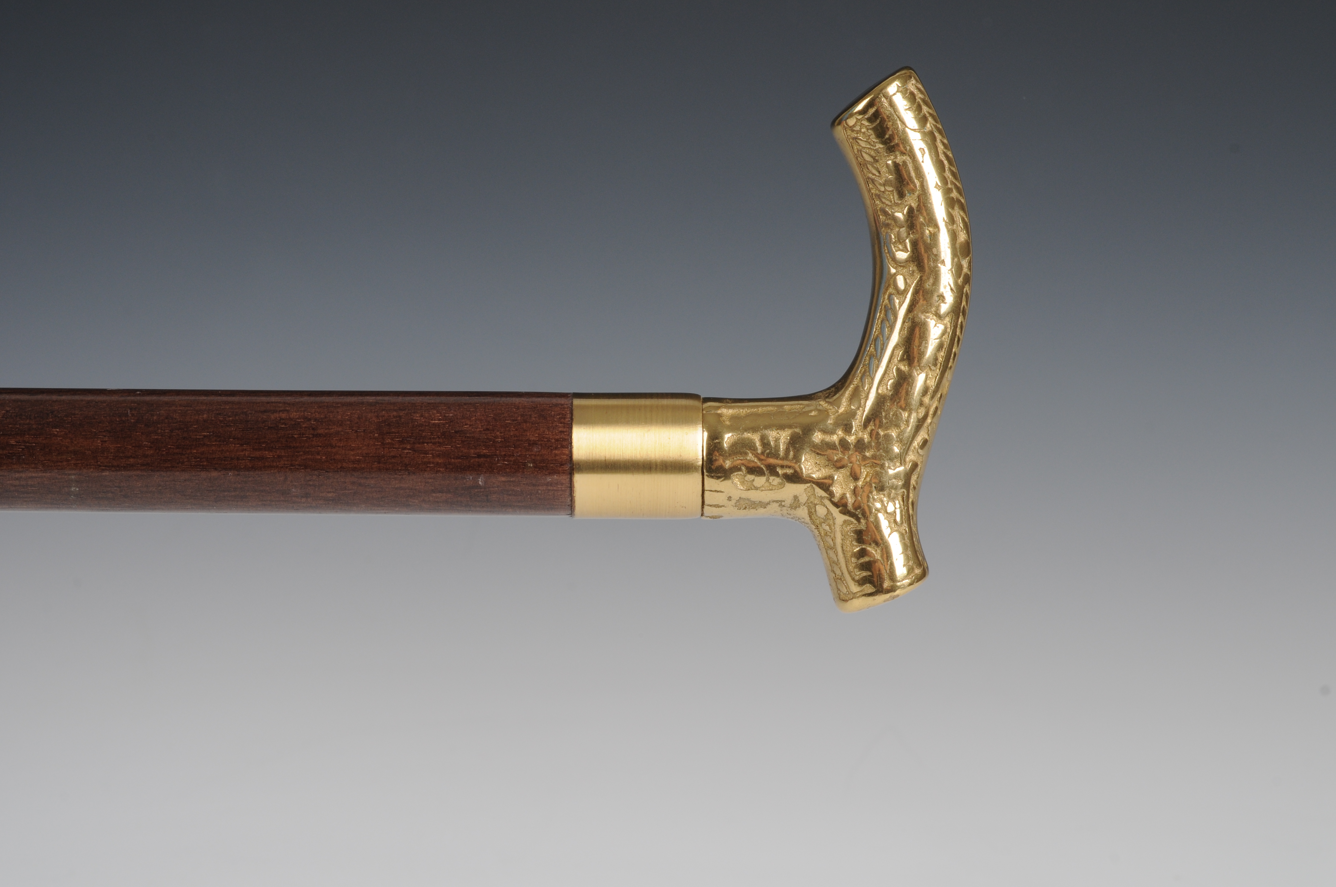 Gold tone handle cane