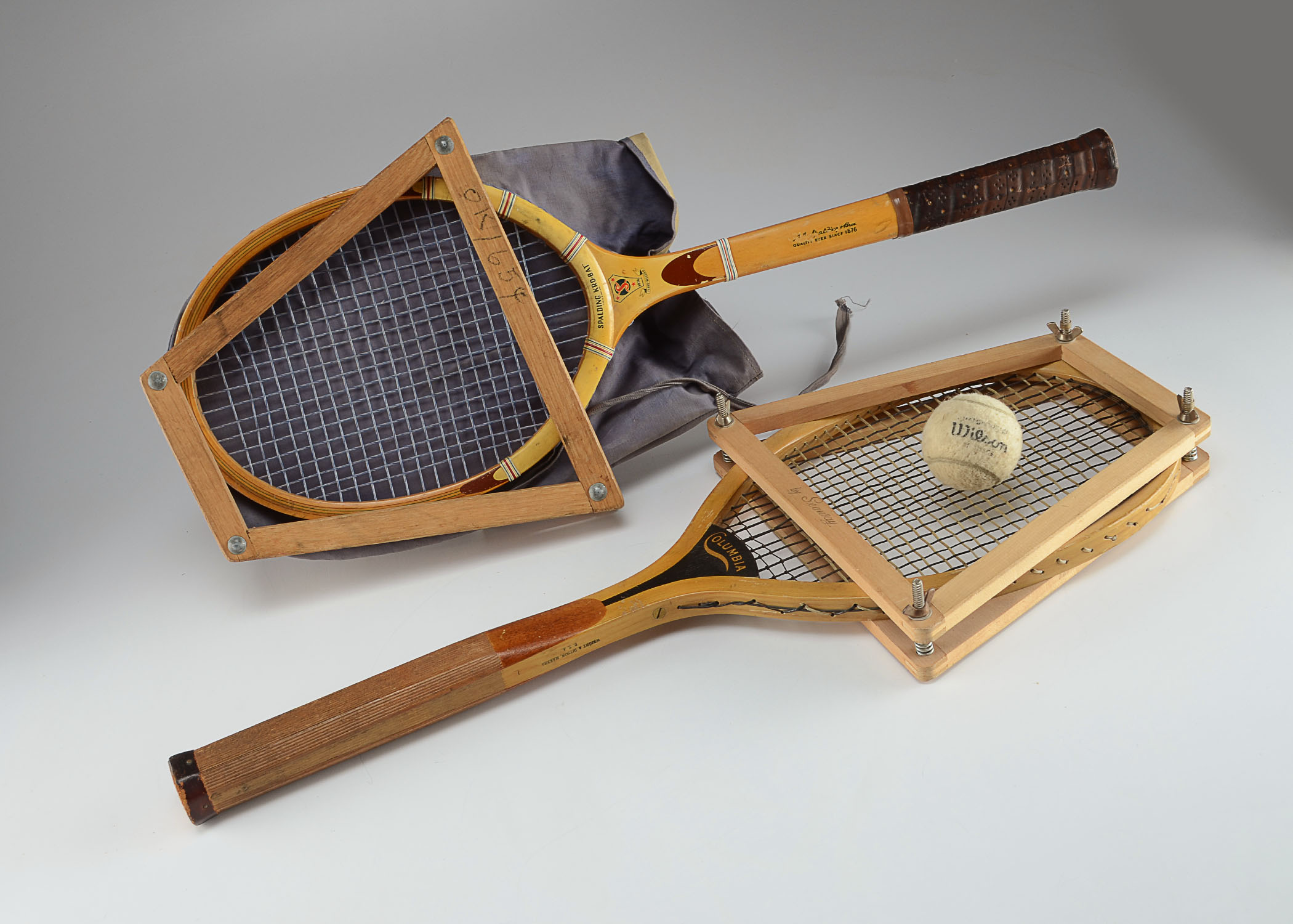 Two vintage wood tennis rackets.