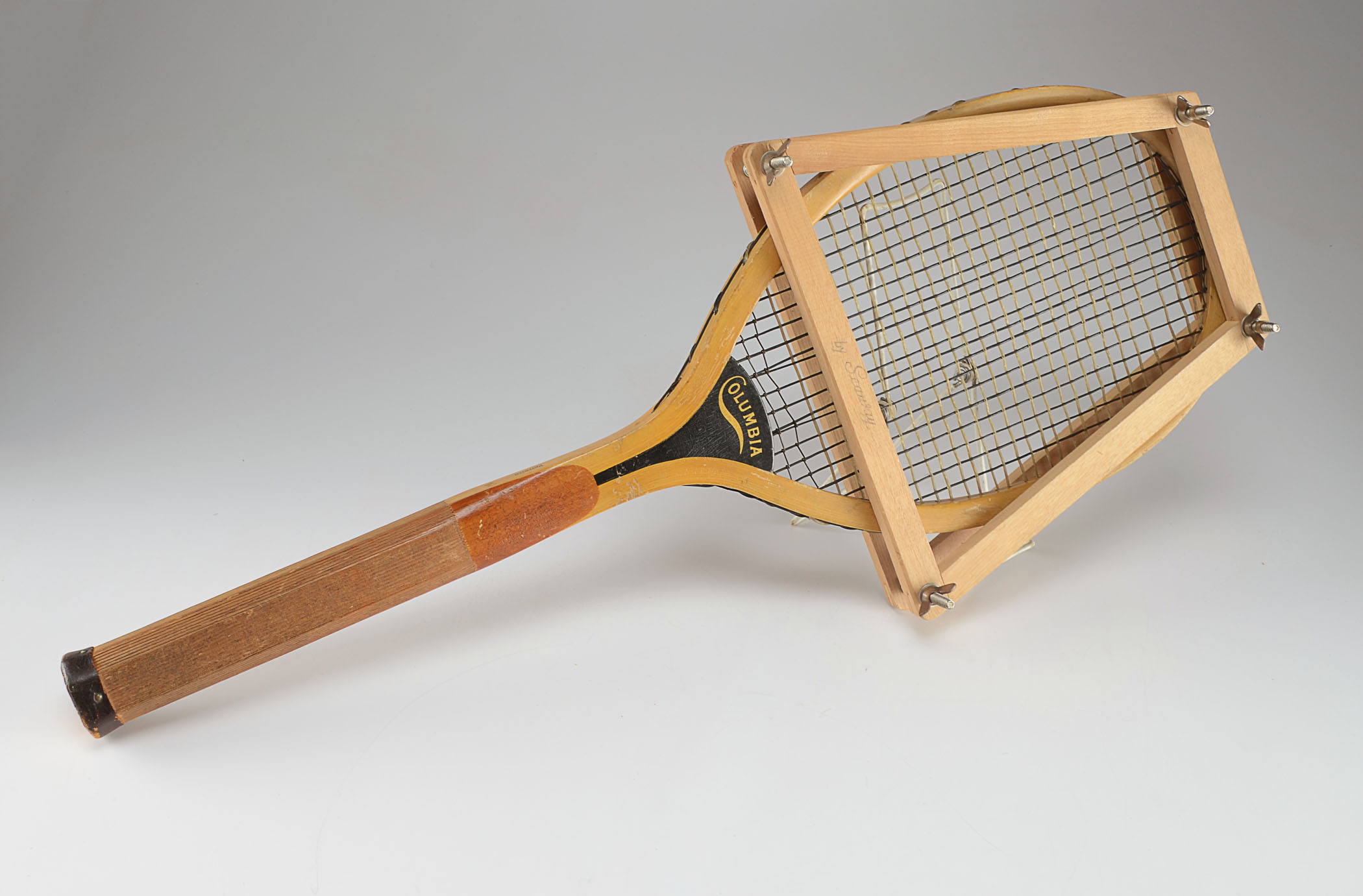 Two vintage wood tennis rackets.