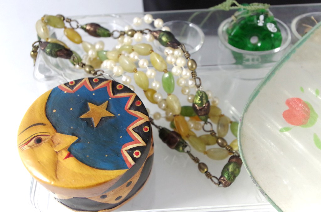 Shelf lot of purses, dresser items,  and jewelry