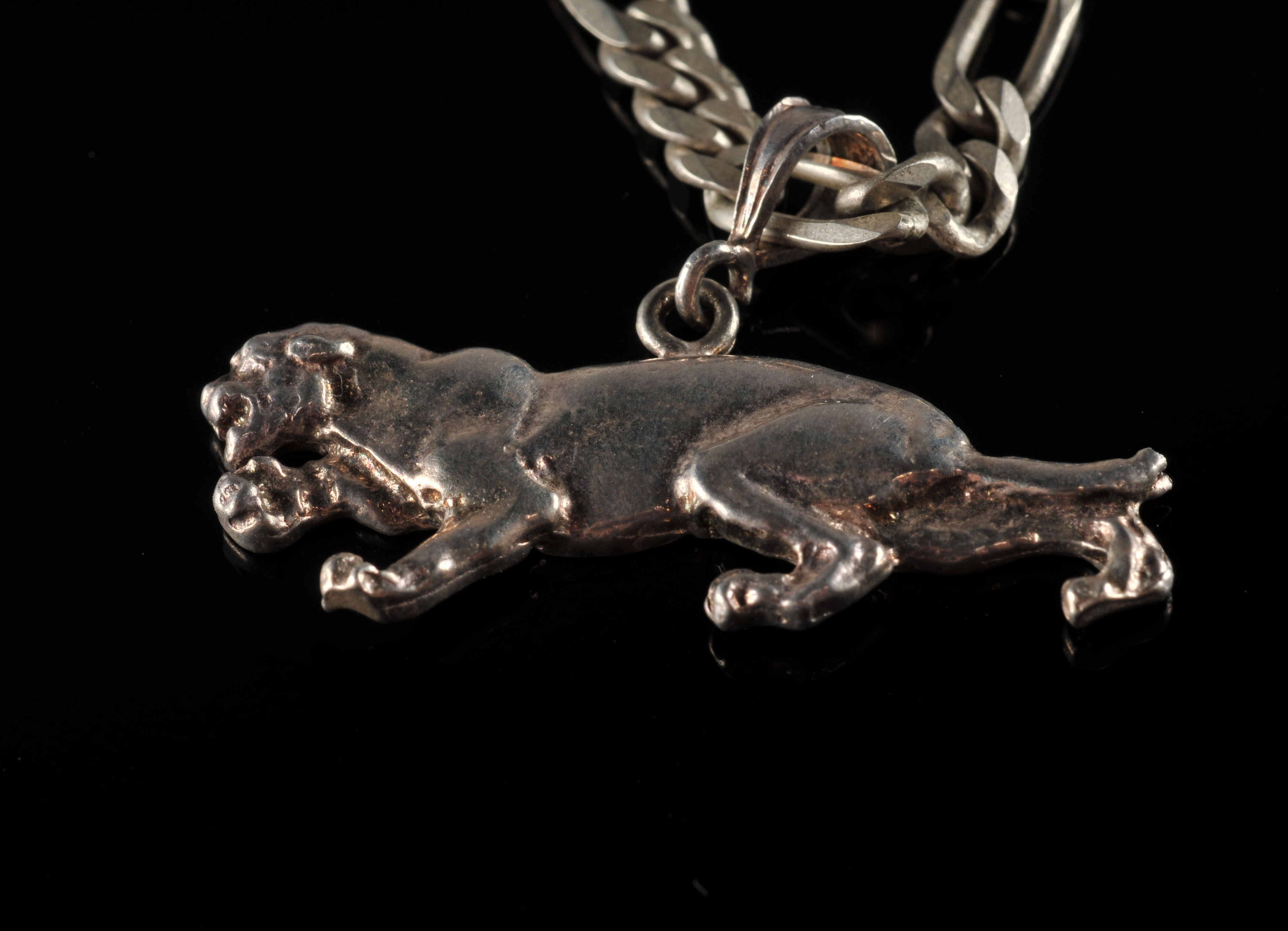 A sterling silver link necklace with a cast sterling silver panther pendant and a sterling silver link braclet