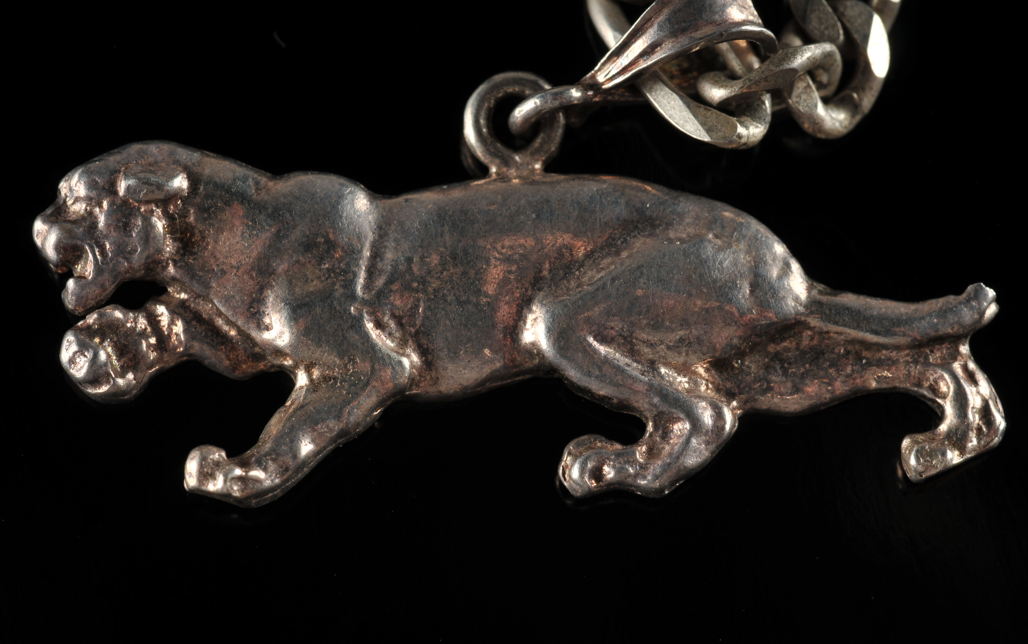 A sterling silver link necklace with a cast sterling silver panther pendant and a sterling silver link braclet