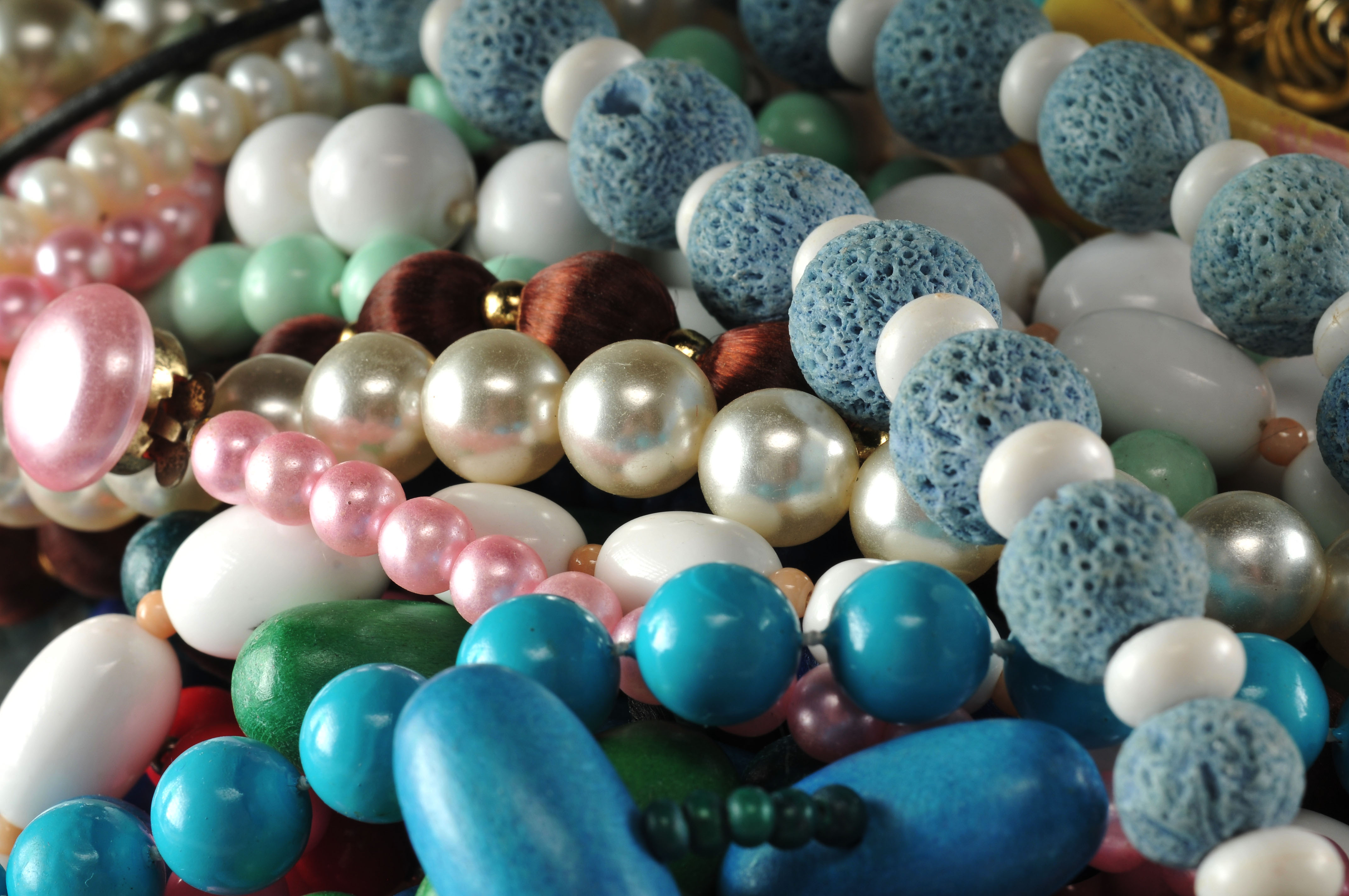 Two gallon size bags full of vintage costume jewelry