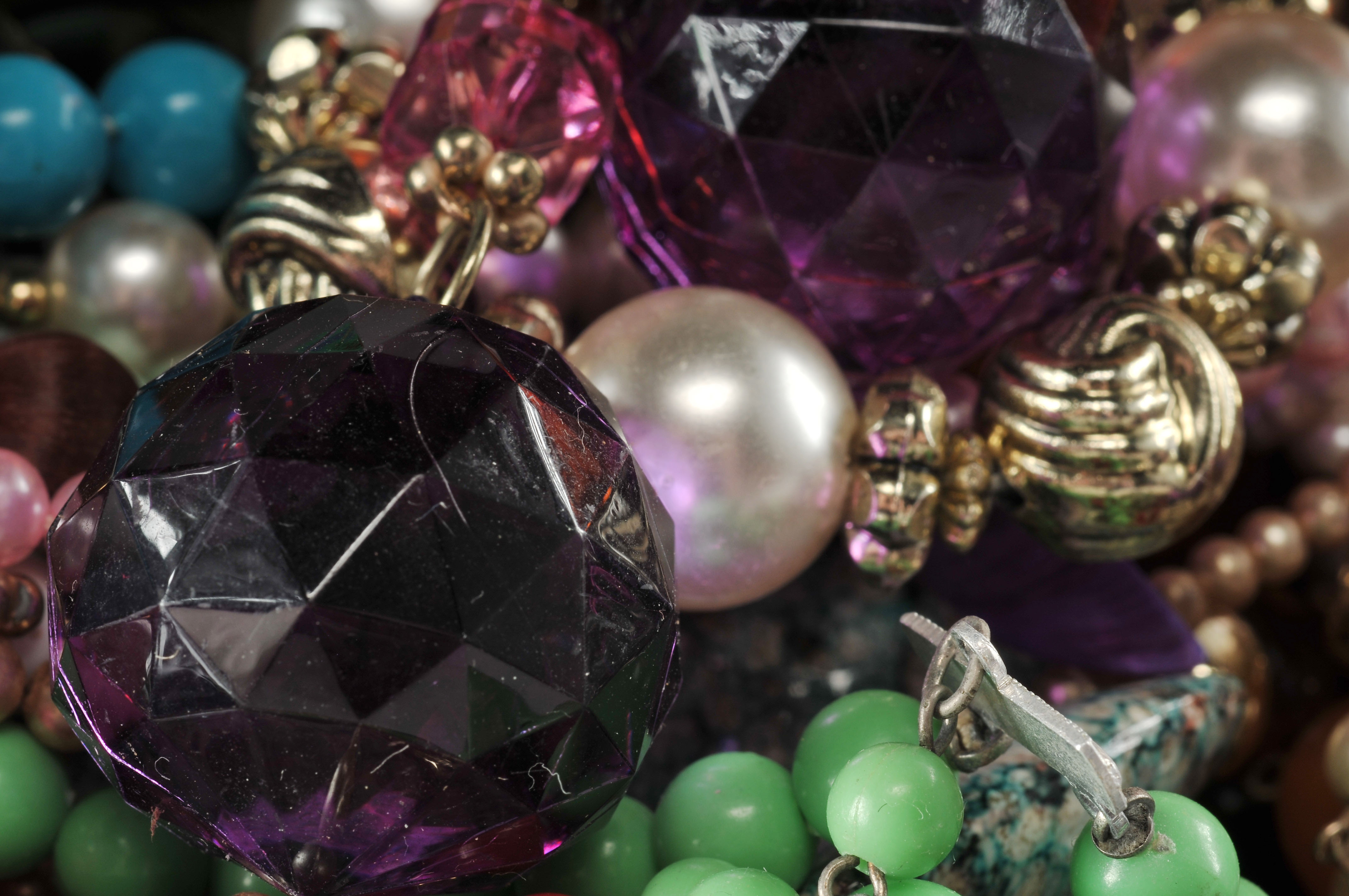 Two gallon size bags full of vintage costume jewelry