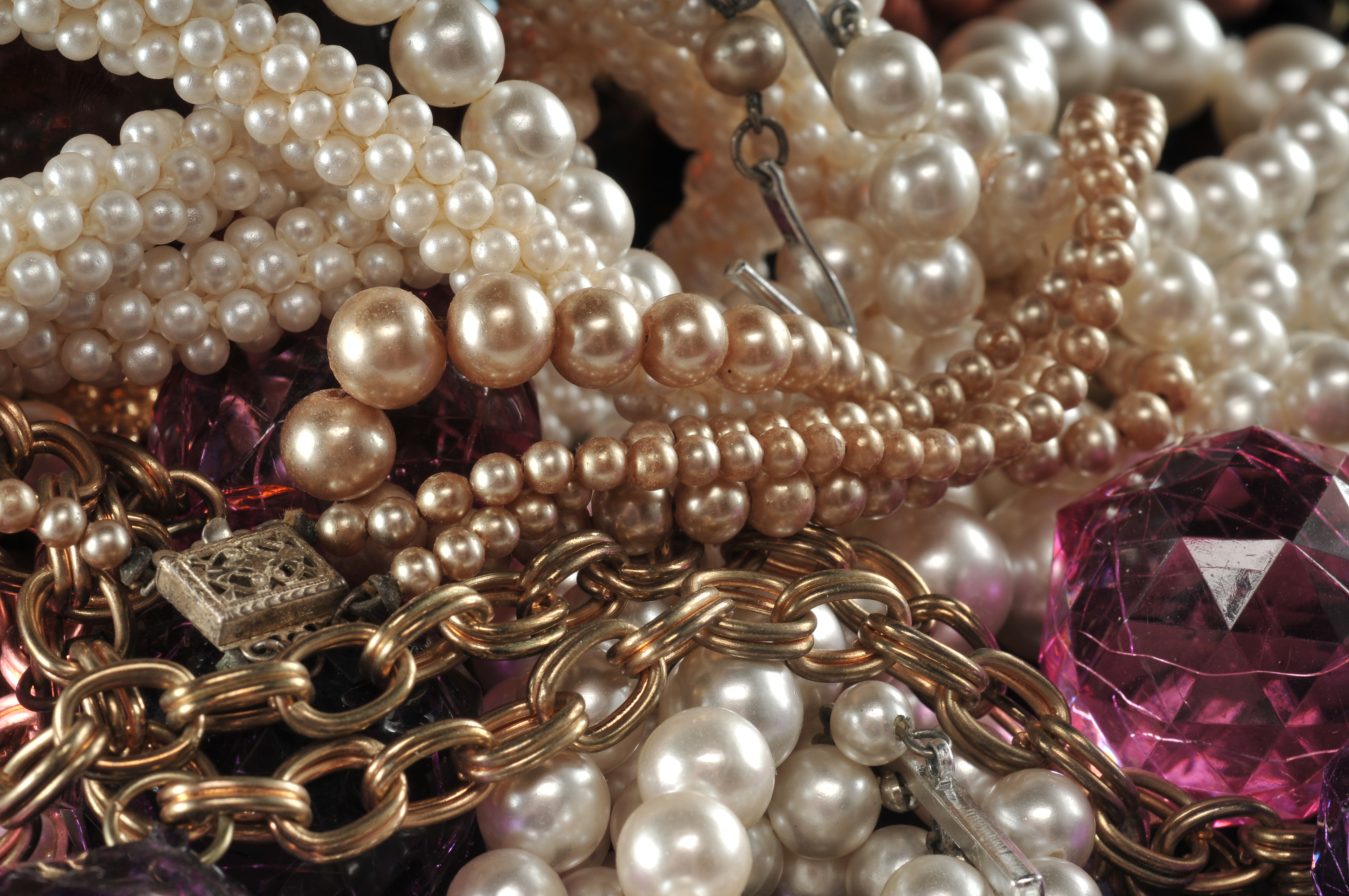 Two gallon size bags full of vintage costume jewelry