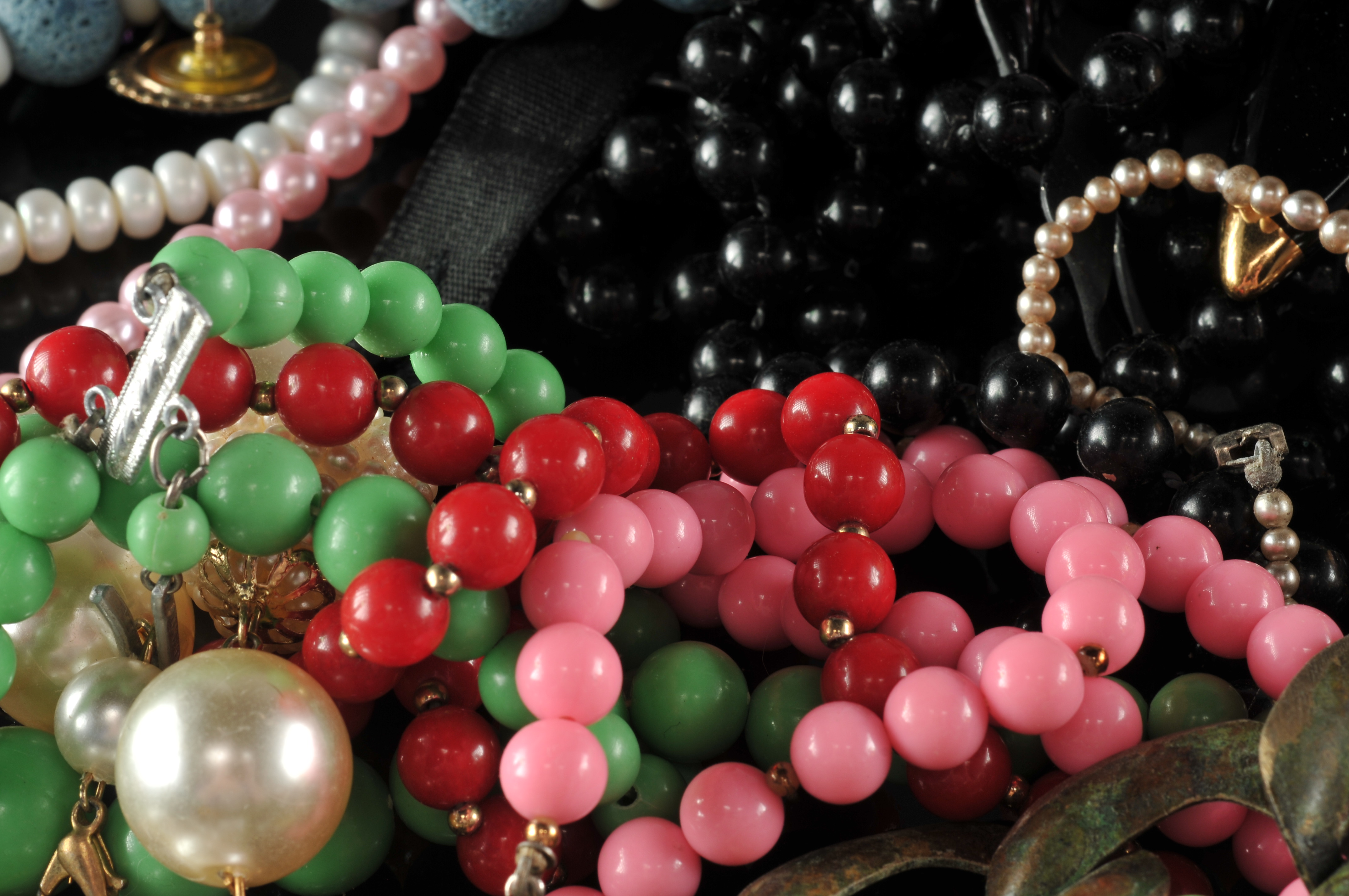 Two gallon size bags full of vintage costume jewelry