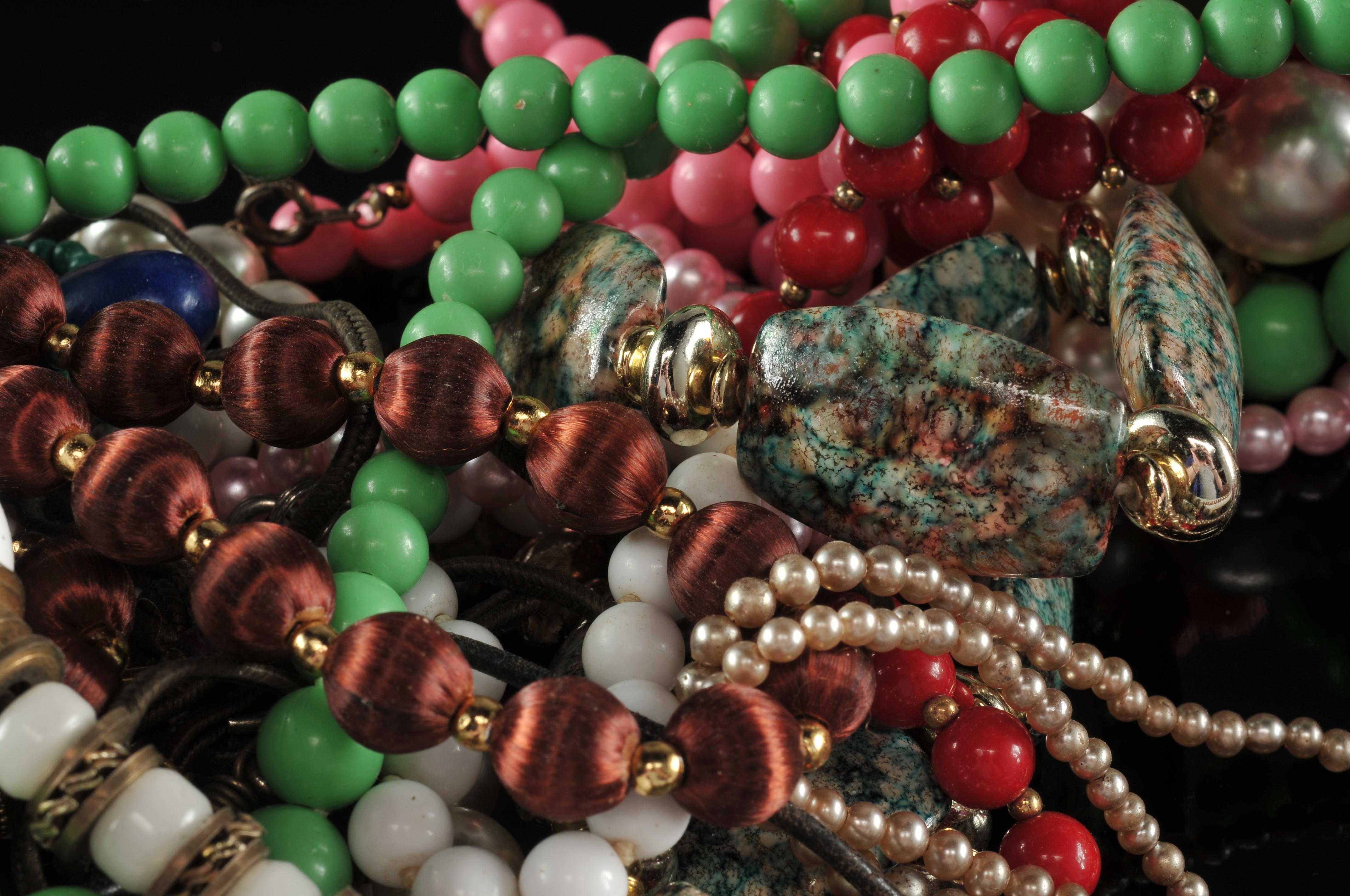 Two gallon size bags full of vintage costume jewelry