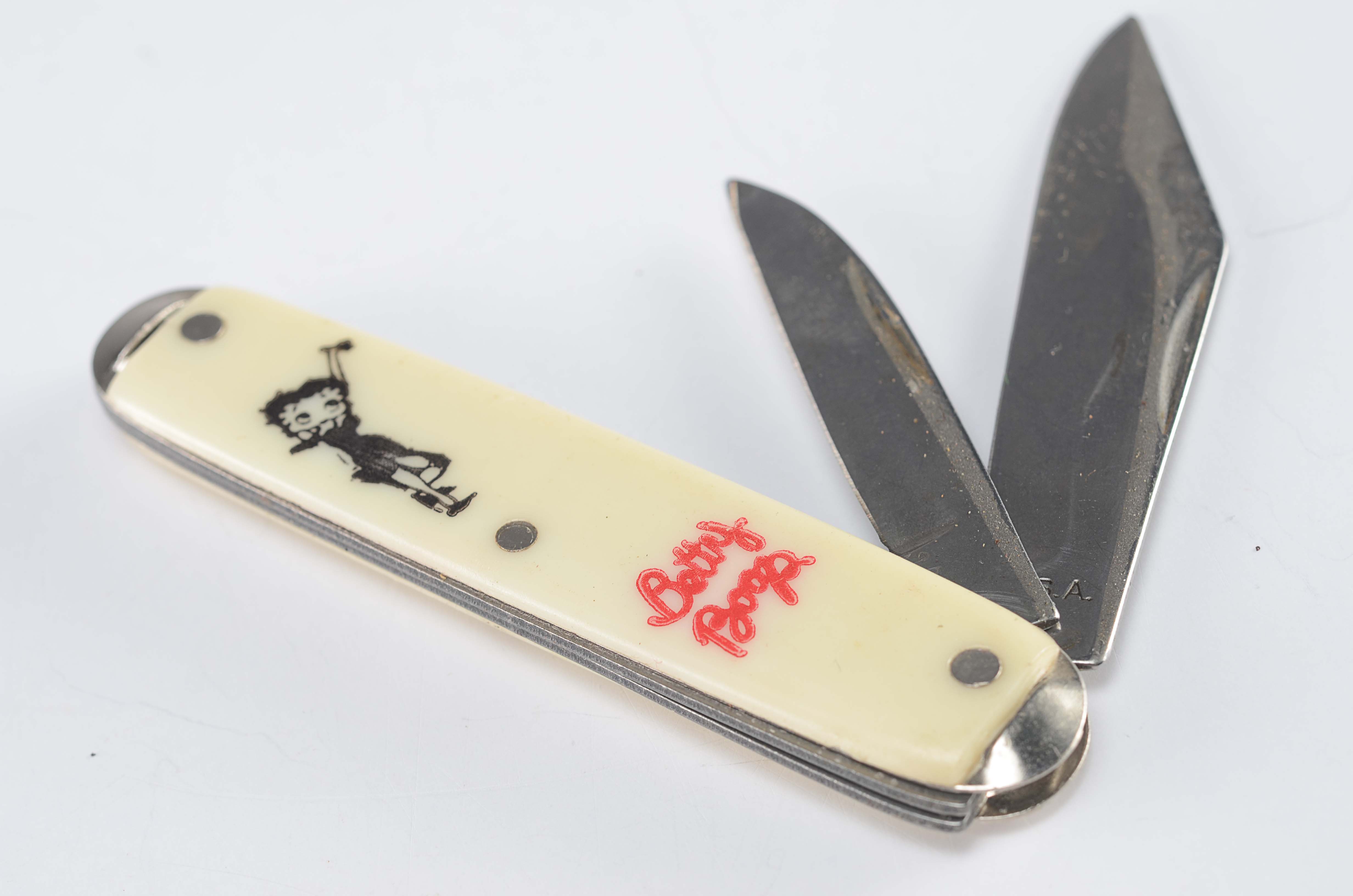 Various themed vintage pocket knives