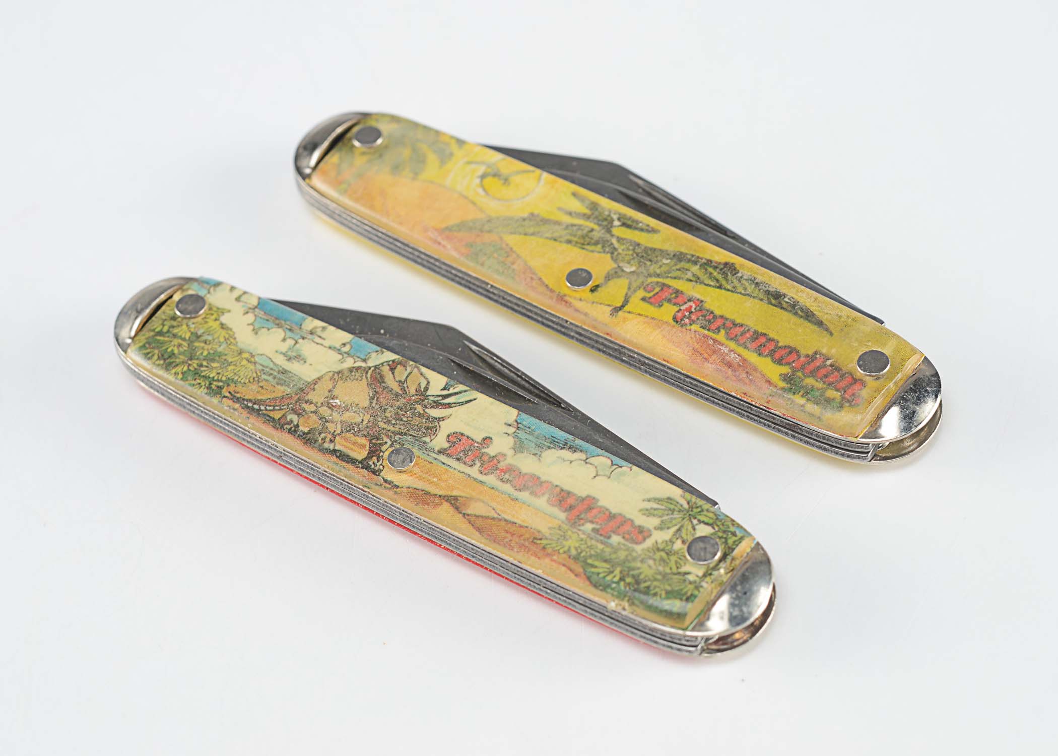 Dinosaur themed vintage pocket knives