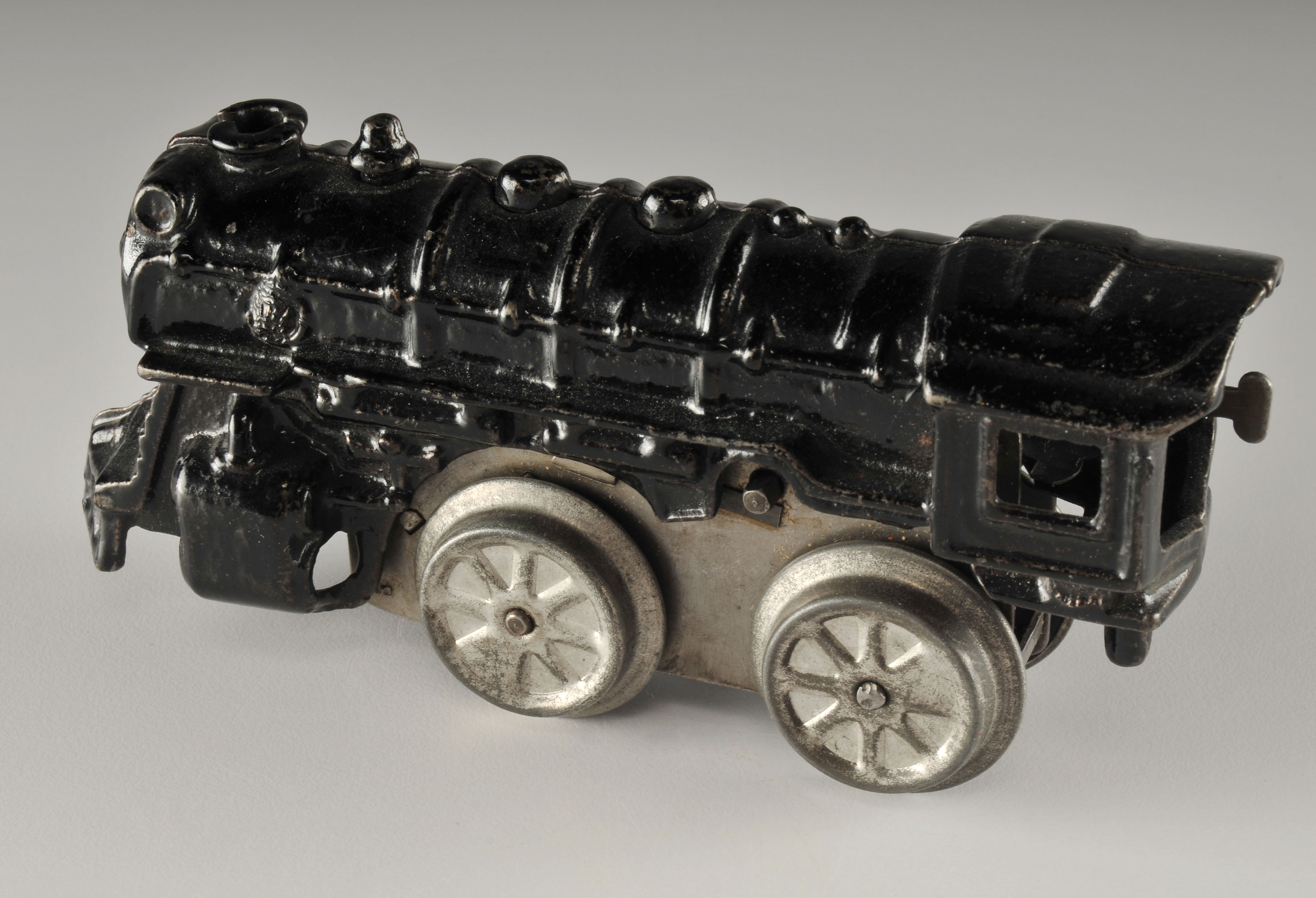 Vintage black enameled cast iron wind up locomotive car