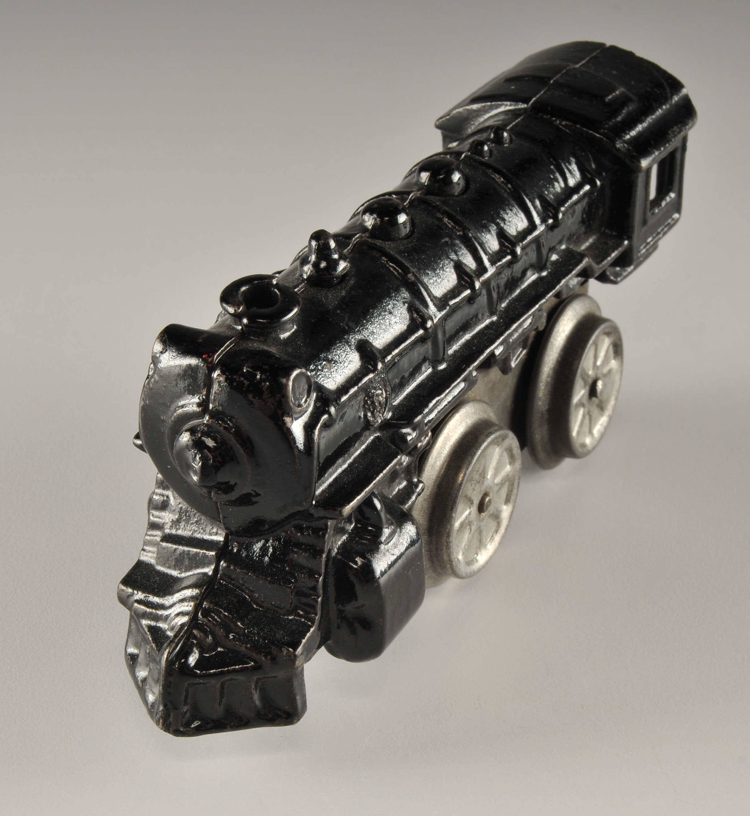 Vintage black enameled cast iron wind up locomotive car