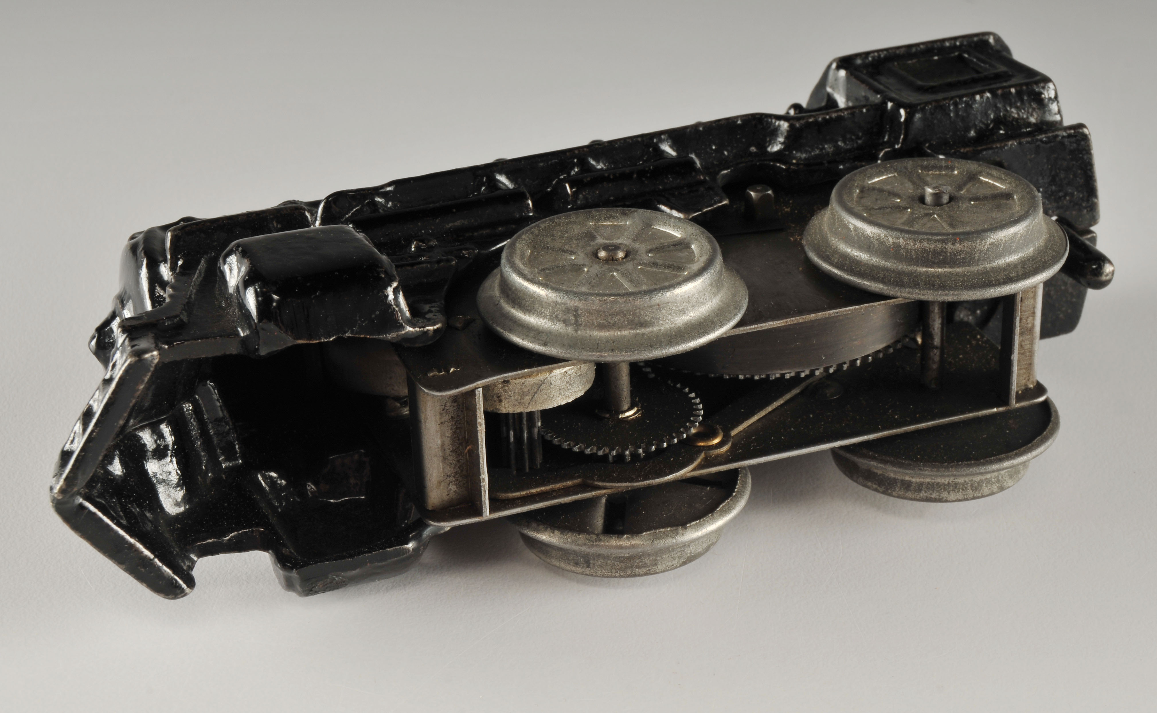 Vintage black enameled cast iron wind up locomotive car