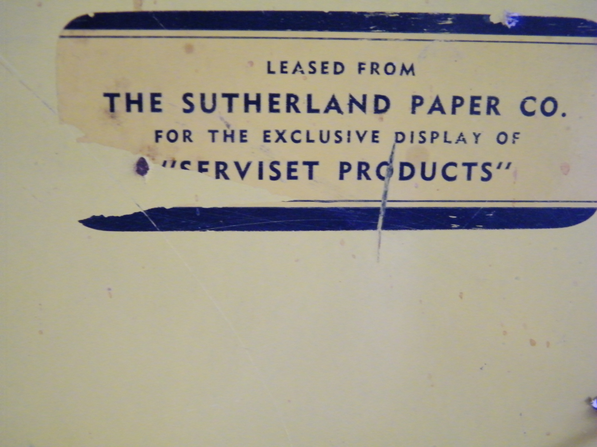 Vintage metal retail display shelf with advertisement