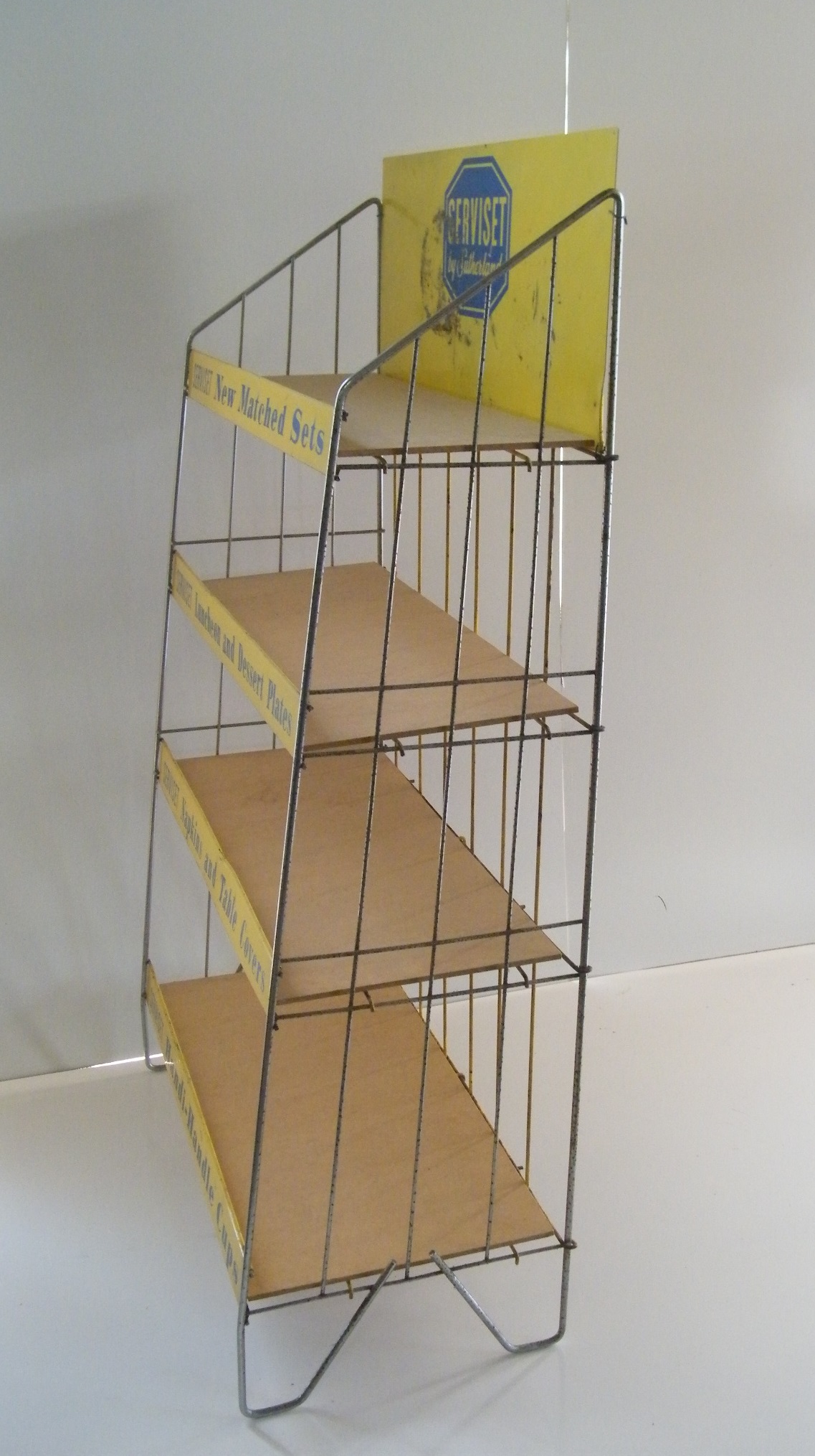 Vintage metal retail display shelf with advertisement