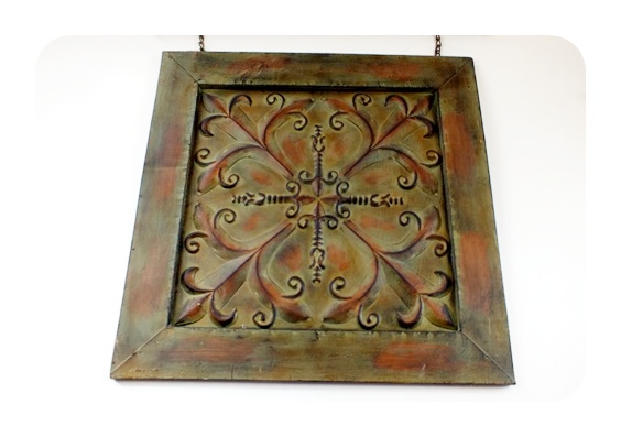 Metal artistic wall hanging with applied antique style finish