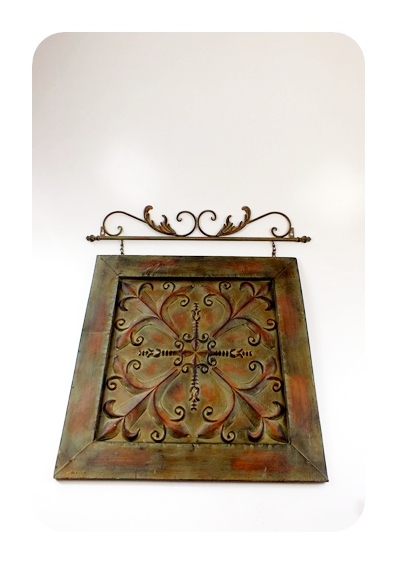 Metal artistic wall hanging with applied antique style finish
