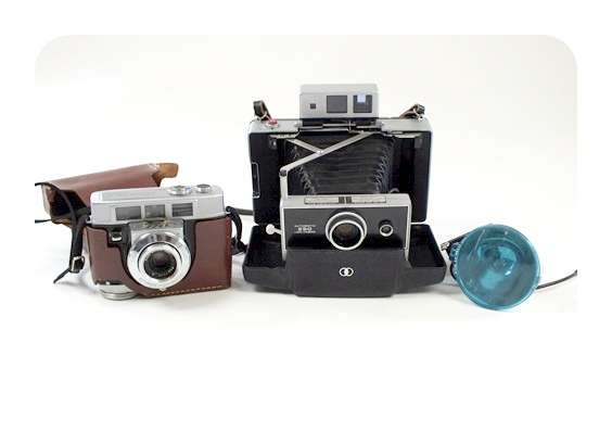 Pair of vintage cameras featuring the Polaroid Automatic 250 Land Camera and more