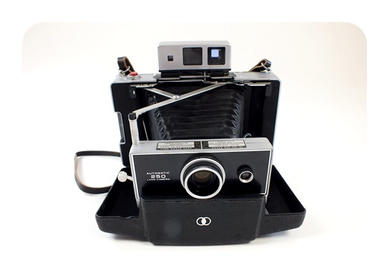 Pair of vintage cameras featuring the Polaroid Automatic 250 Land Camera and more