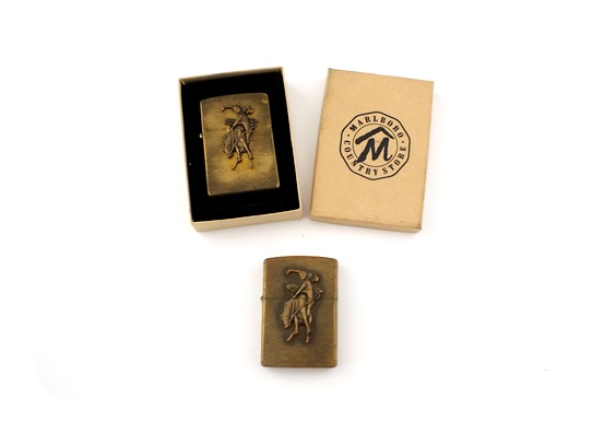 Pair of vintage solid brass Zippo lighters with Marlboro cowboy on horse