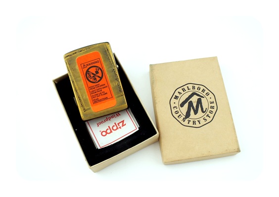 Pair of vintage solid brass Zippo lighters with Marlboro cowboy on horse