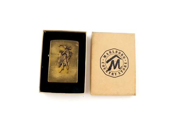 Pair of vintage solid brass Zippo lighters with Marlboro cowboy on horse