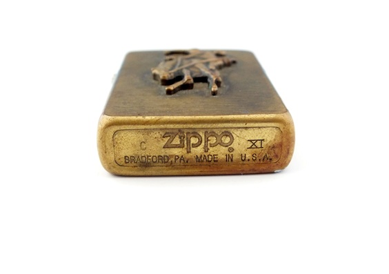 Pair of vintage solid brass Zippo lighters with Marlboro cowboy on horse