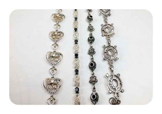 Four ornate sterling bracelets