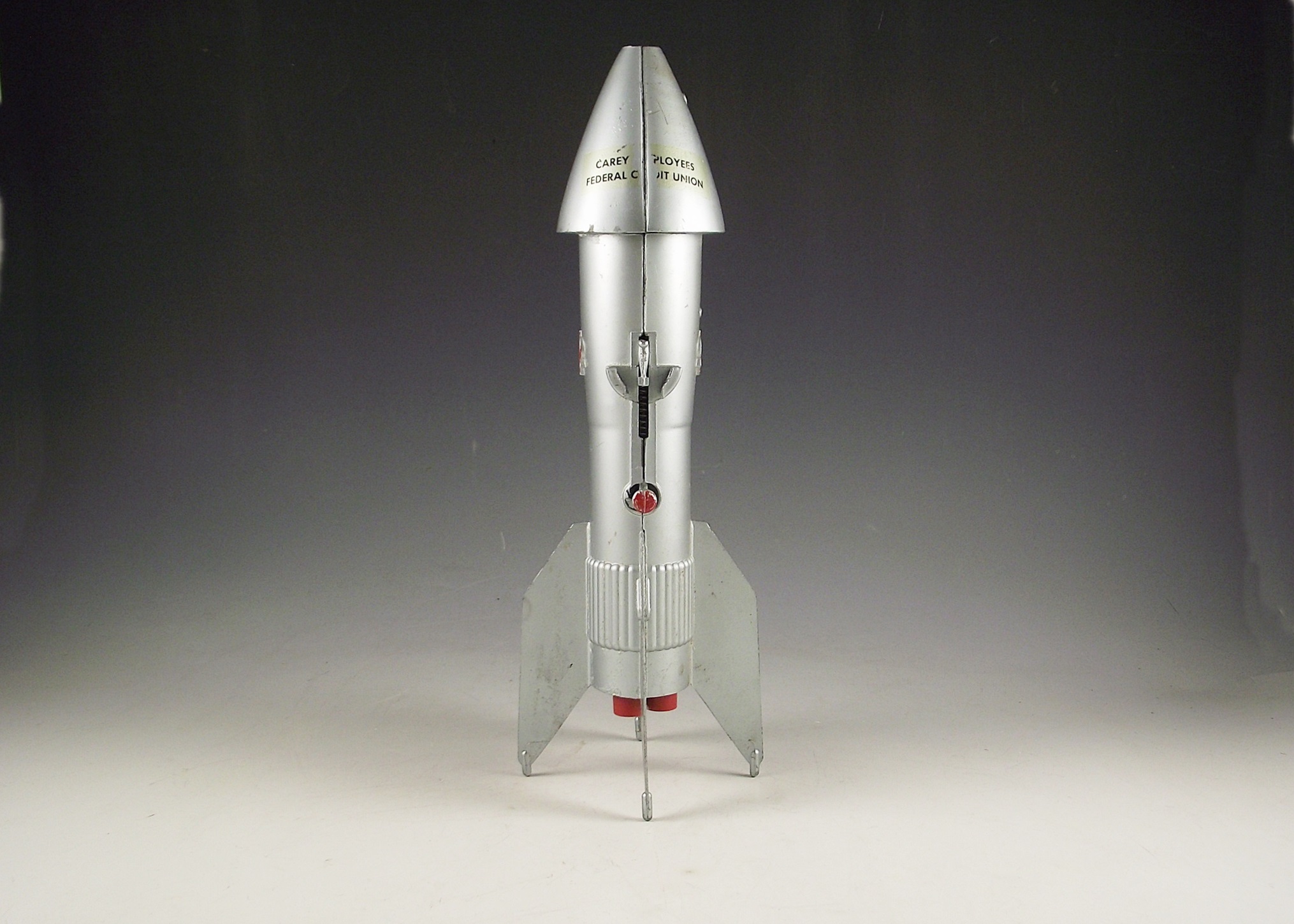 1957 Astro Mfg. die cast metal rocket bank.