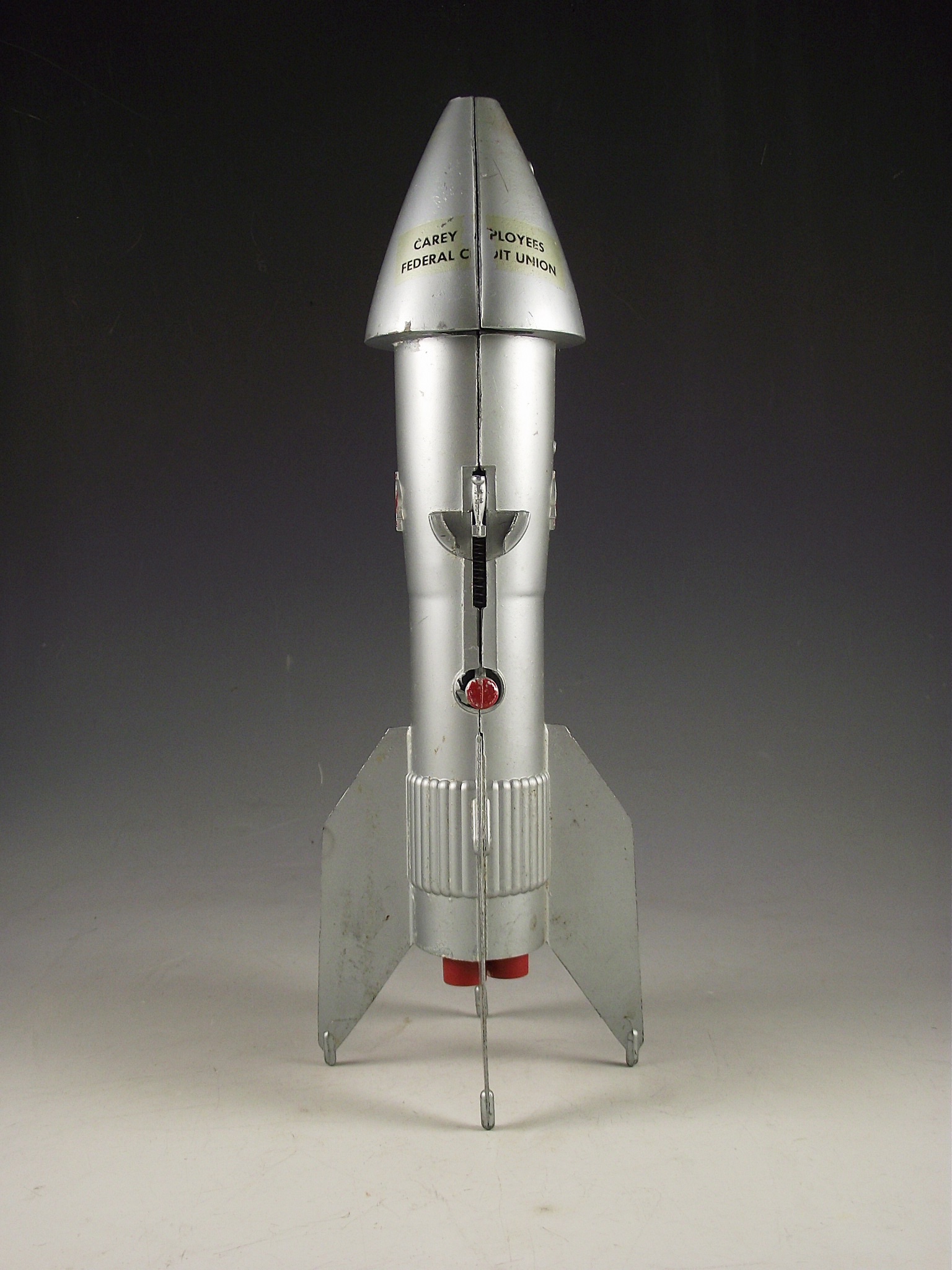 1957 Astro Mfg. die cast metal rocket bank.