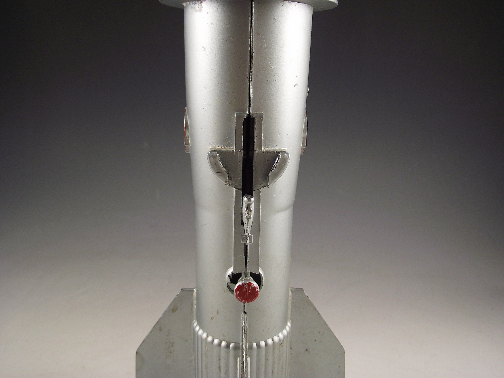 1957 Astro Mfg. die cast metal rocket bank.