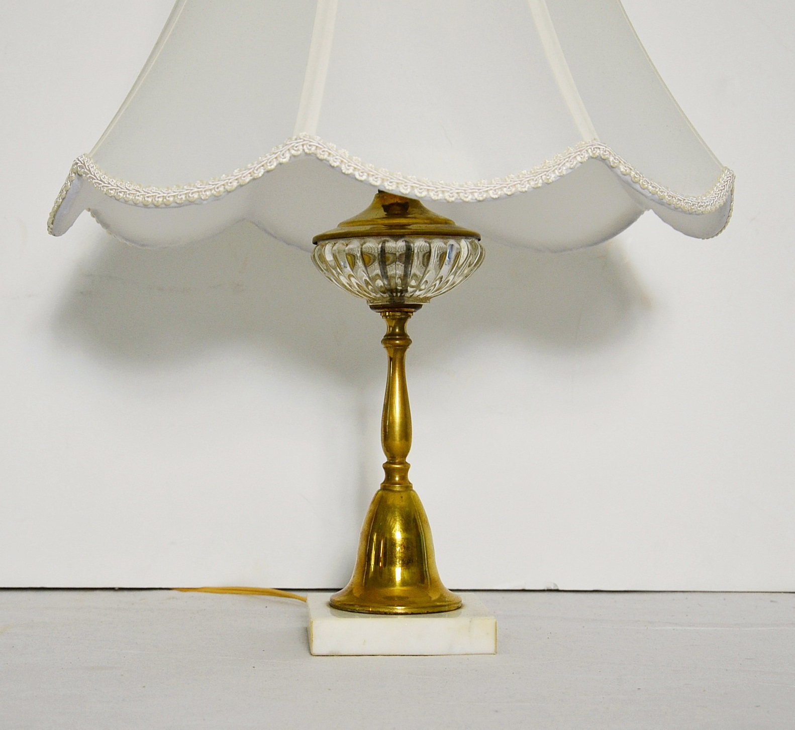 Brass candlestick lamp.