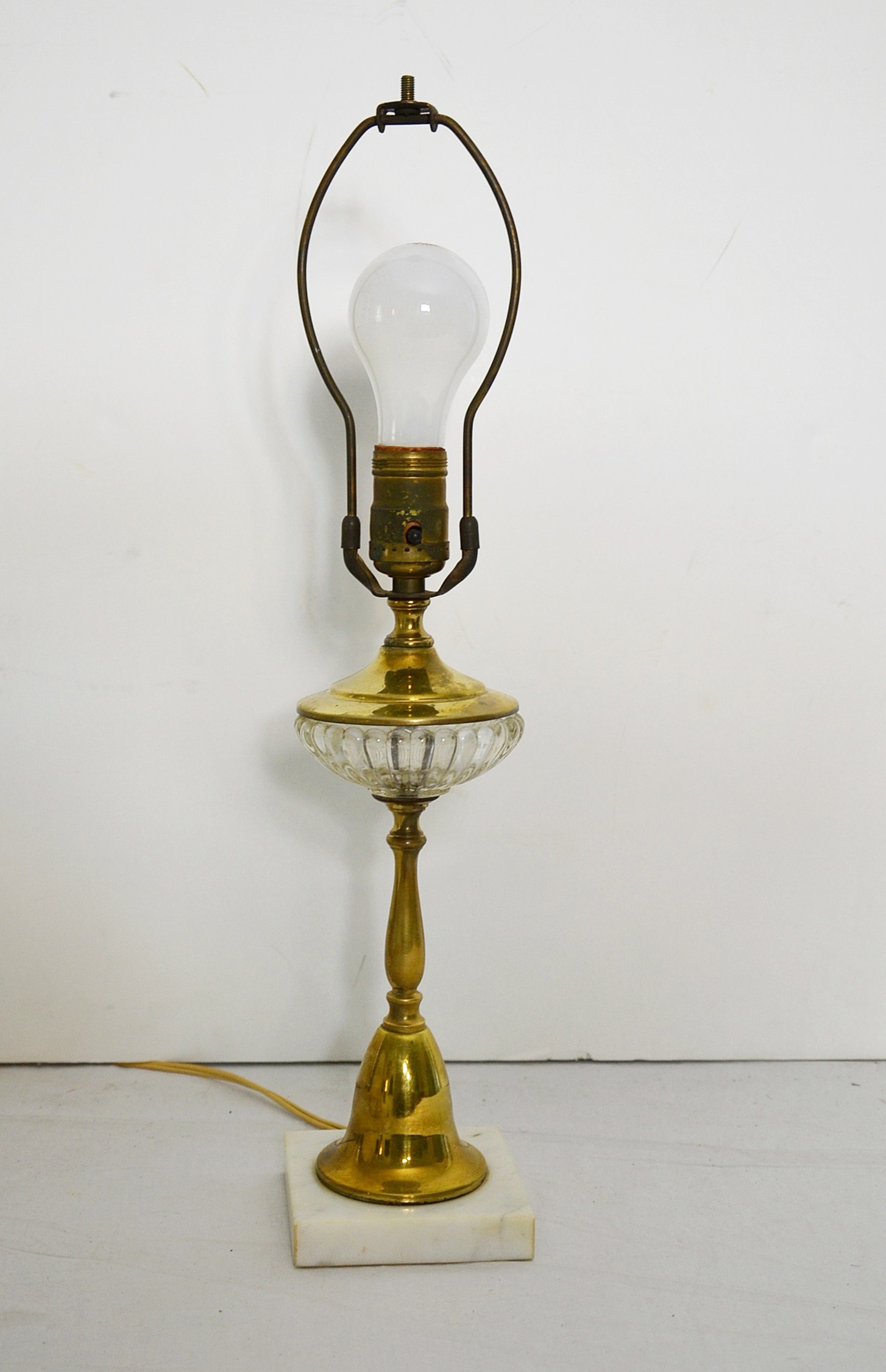 Brass candlestick lamp.