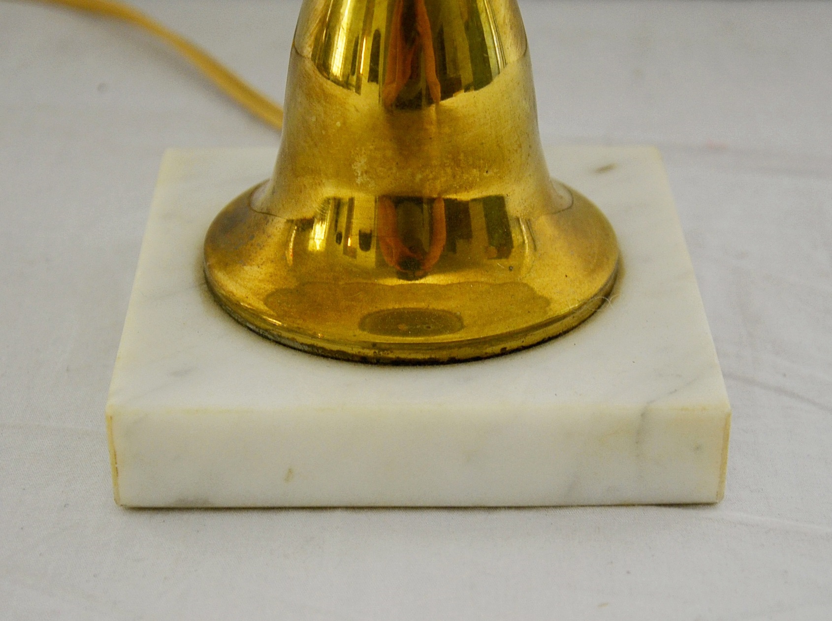 Brass candlestick lamp.