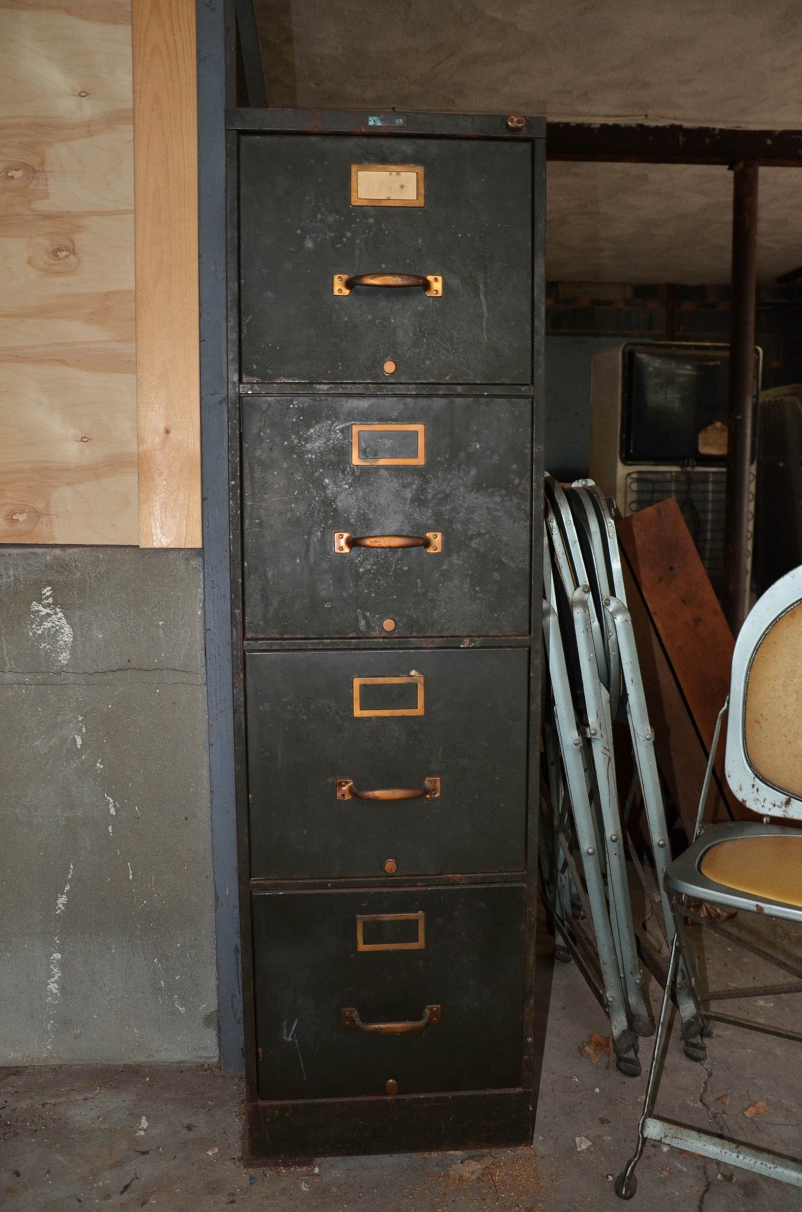 Vintage filing cabinet and folding chairs.