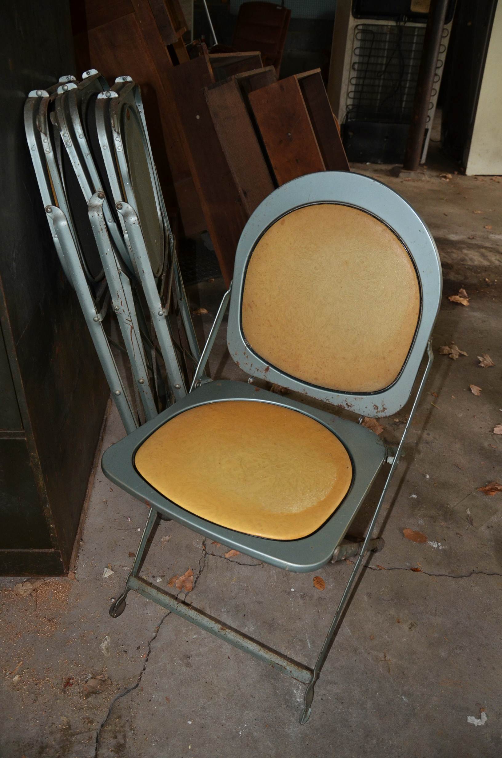 Vintage filing cabinet and folding chairs.
