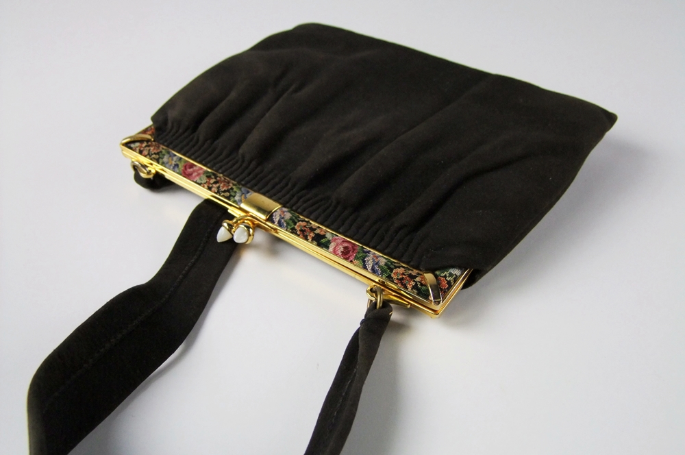 Three vintage handbags including a black purse with petit point 