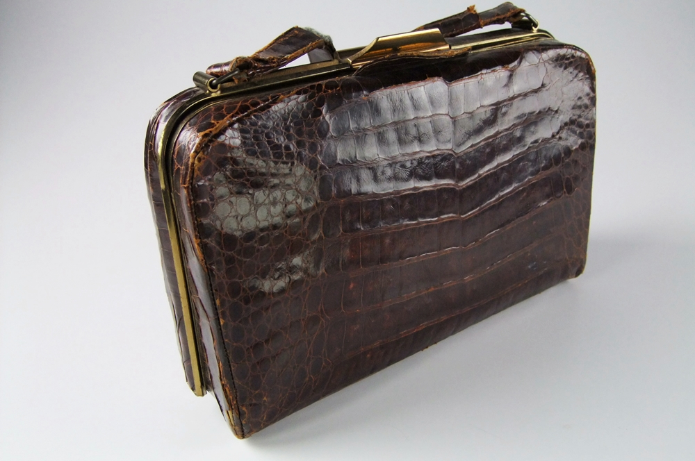 Three vintage handbags including a black purse with petit point 