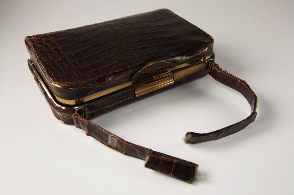 Three vintage handbags including a black purse with petit point 
